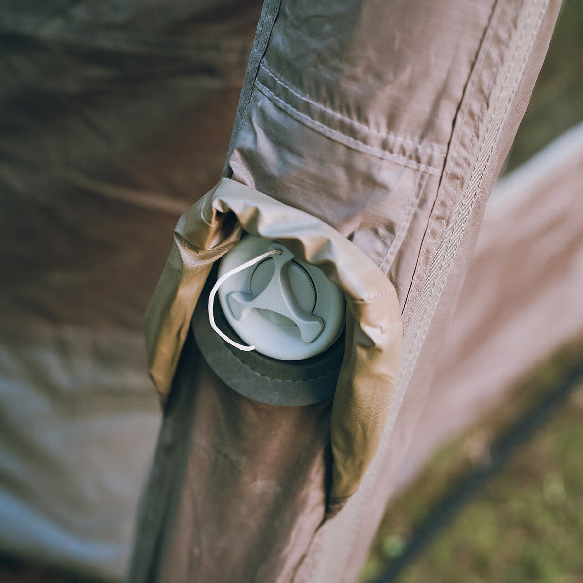 Aero Cumulus Shell, Brown, close-up of one of the eight air valves in its covered pocket