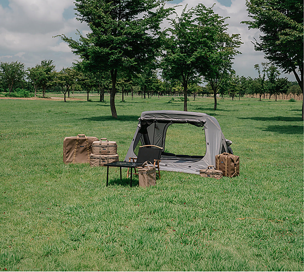 Coyote Tan CORDURA FD Chair Case at a campsite beside a tent and table