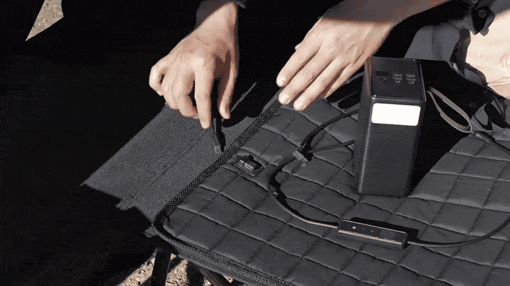 Connecting a USB-C cable from a power bank into the Carbon Heating Pad Large