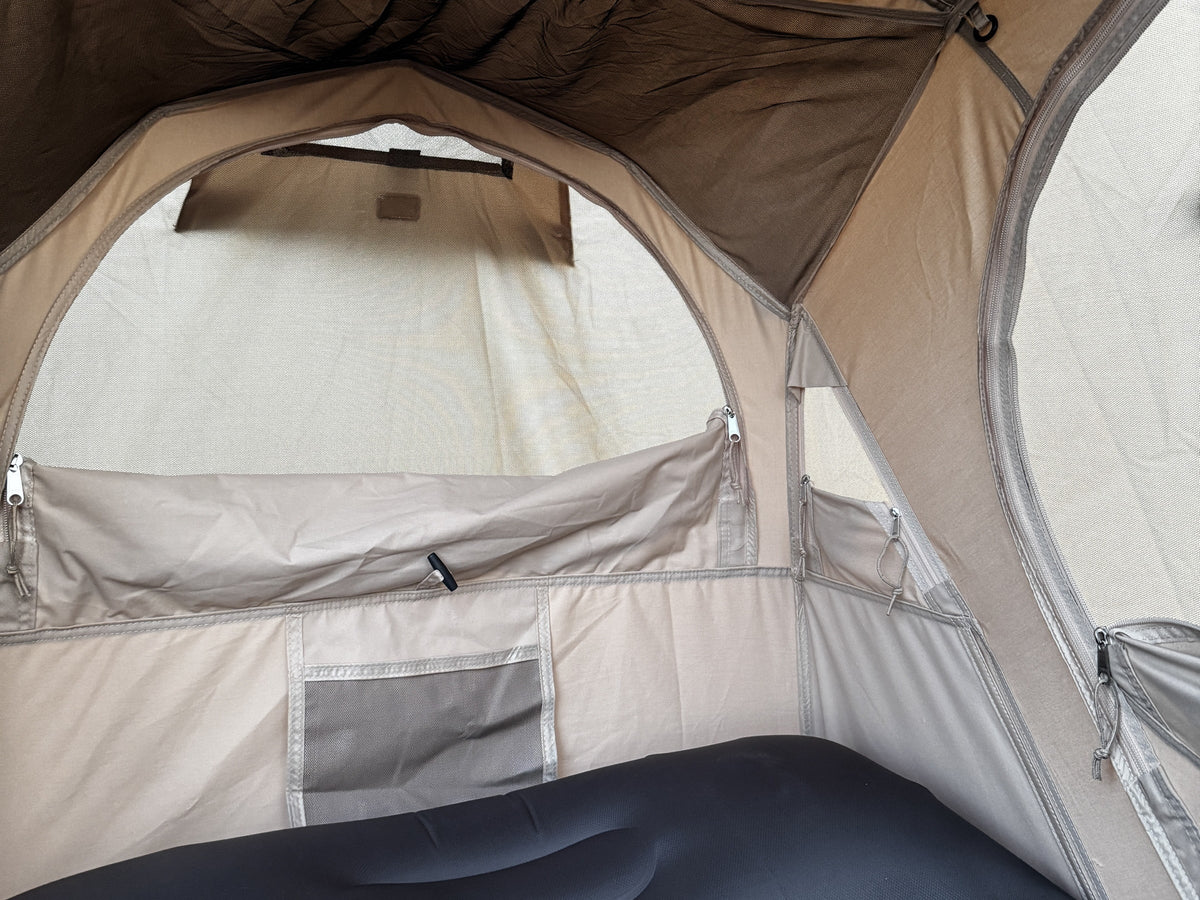 Under the Natural rainfly: light through its roof window onto the tent loft and end wall (tent and pad sold separately).