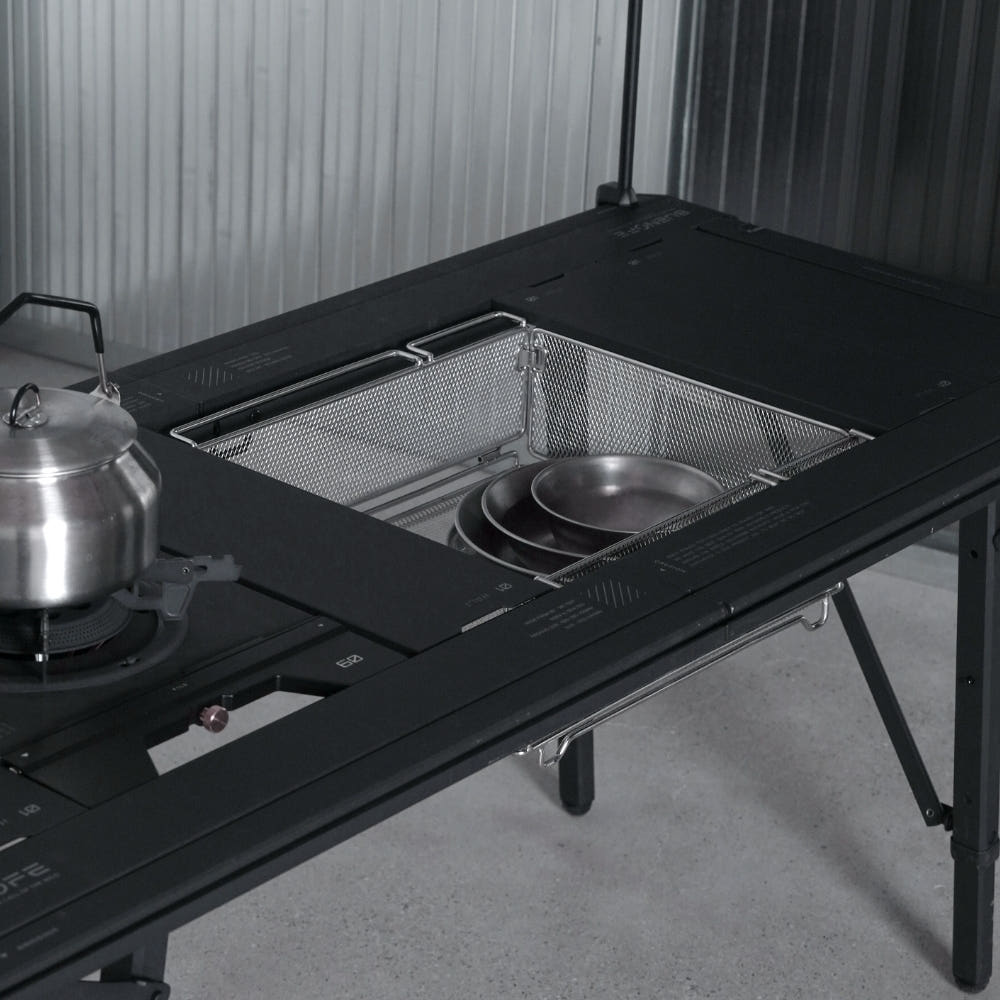 BUENOFE IGT Mesh Tray 1.5 holding a stainless kettle and pot in a dark camp kitchen setup