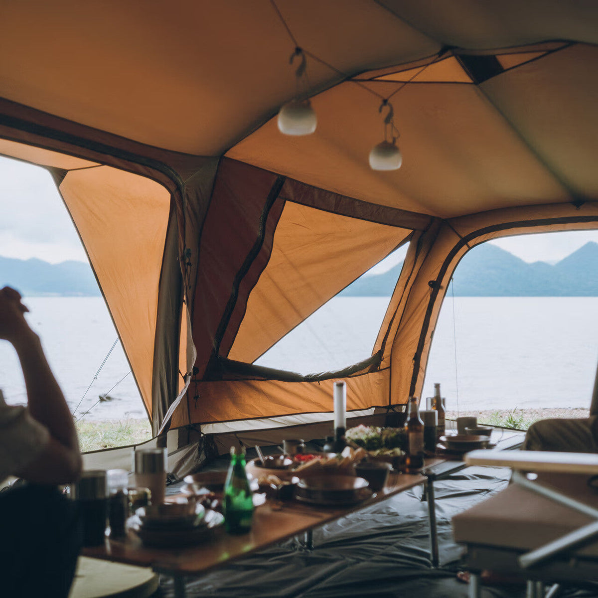 Aero Cumulus Shell, Brown, interior ceiling with lanterns hung from it