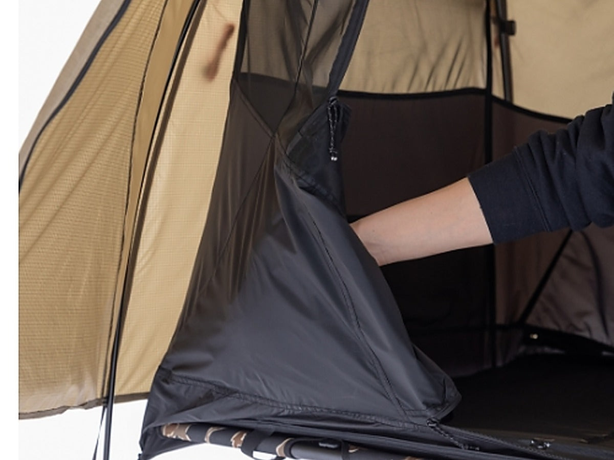 Hand tucking the inner tent door into the door pocket