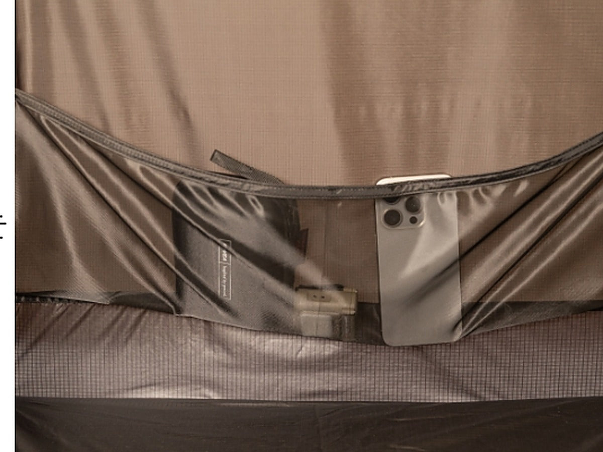 Phone and small items stored in the interior mesh pocket