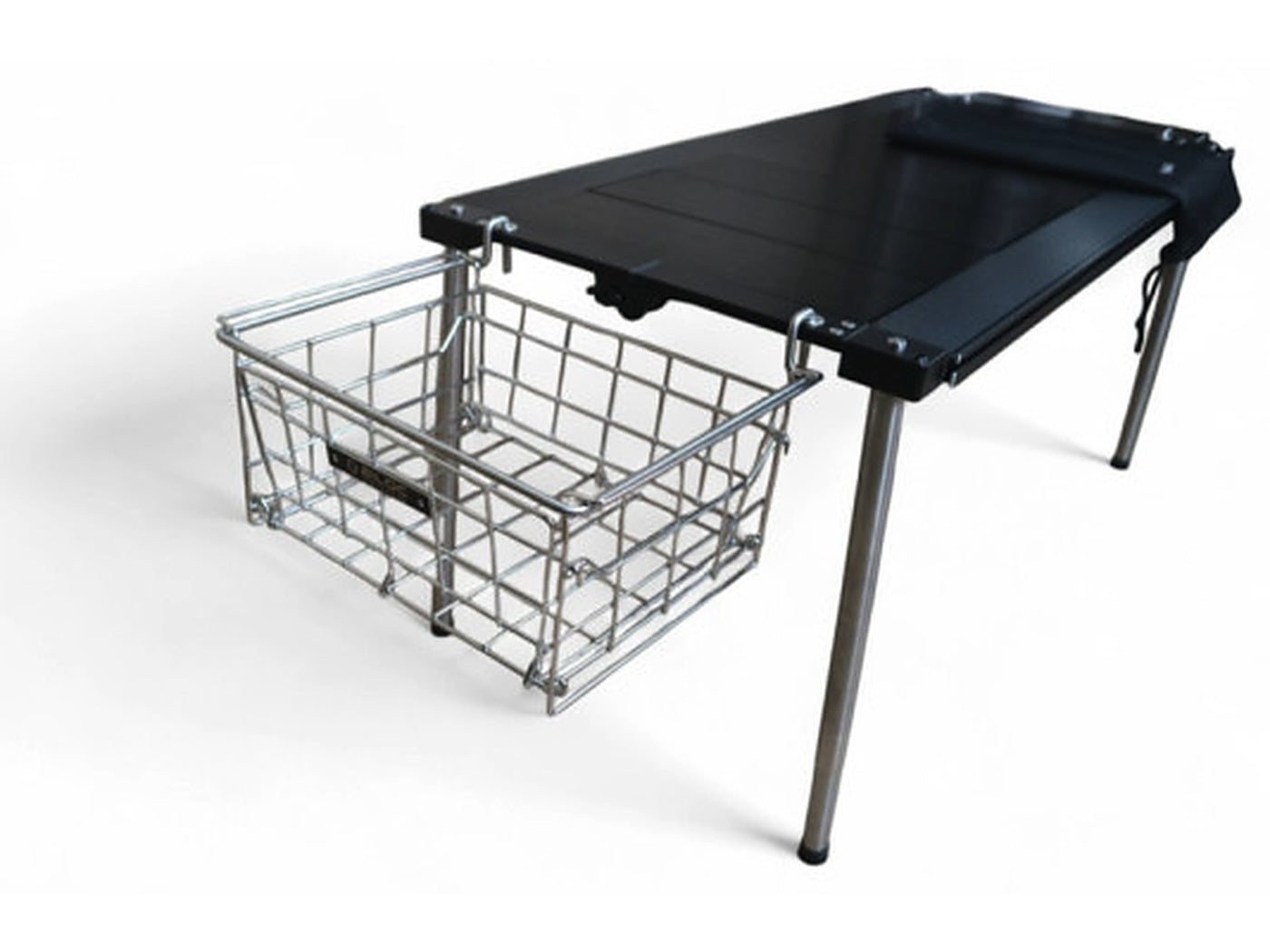 Folding wire basket hanging from a side hanger below a table edge. The hanger and table are separate purchases.