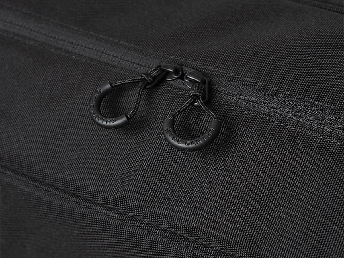 Close-up of the paired YKK zipper pulls on the black CORDURA FD Chair Case