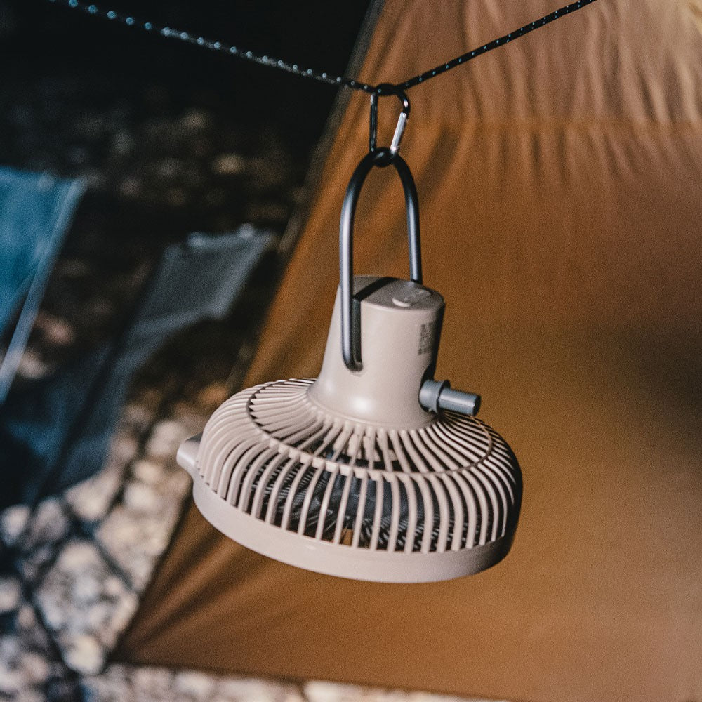 V600+ fan hanging upside down from a tent ceiling by its wire handle and a carabiner