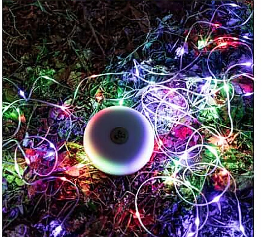 String light glowing in multicolor RGB breathing mode on the ground
