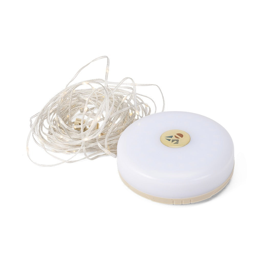 Evernine Lily Lantern with its 9-meter warm LED string light coiled beside it