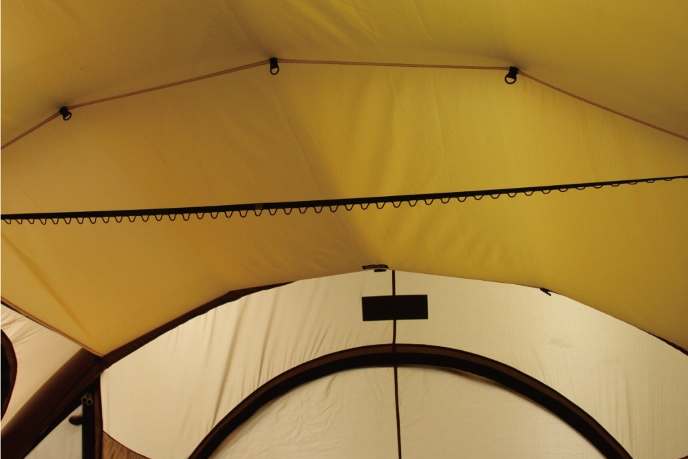 Inner tent ceiling showing the ridge vent and arched doorway