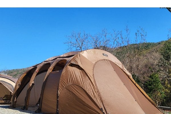 Gopamir T720+ Living Air Shelter, Sand Brown, double-wall shelter pitched on a gravel site