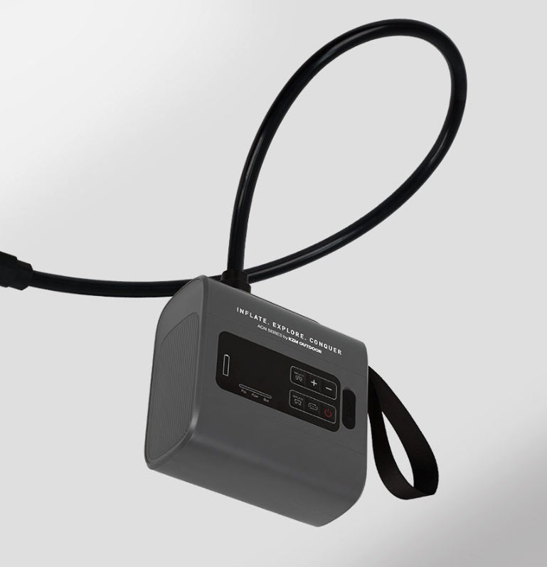 Pump being carried by strap at a campsite, no cord visible