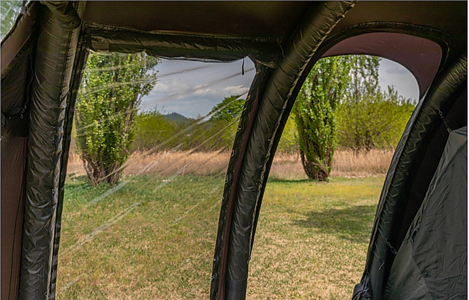 View from inside the shelter looking out through the clear TPU window onto the surrounding scenery