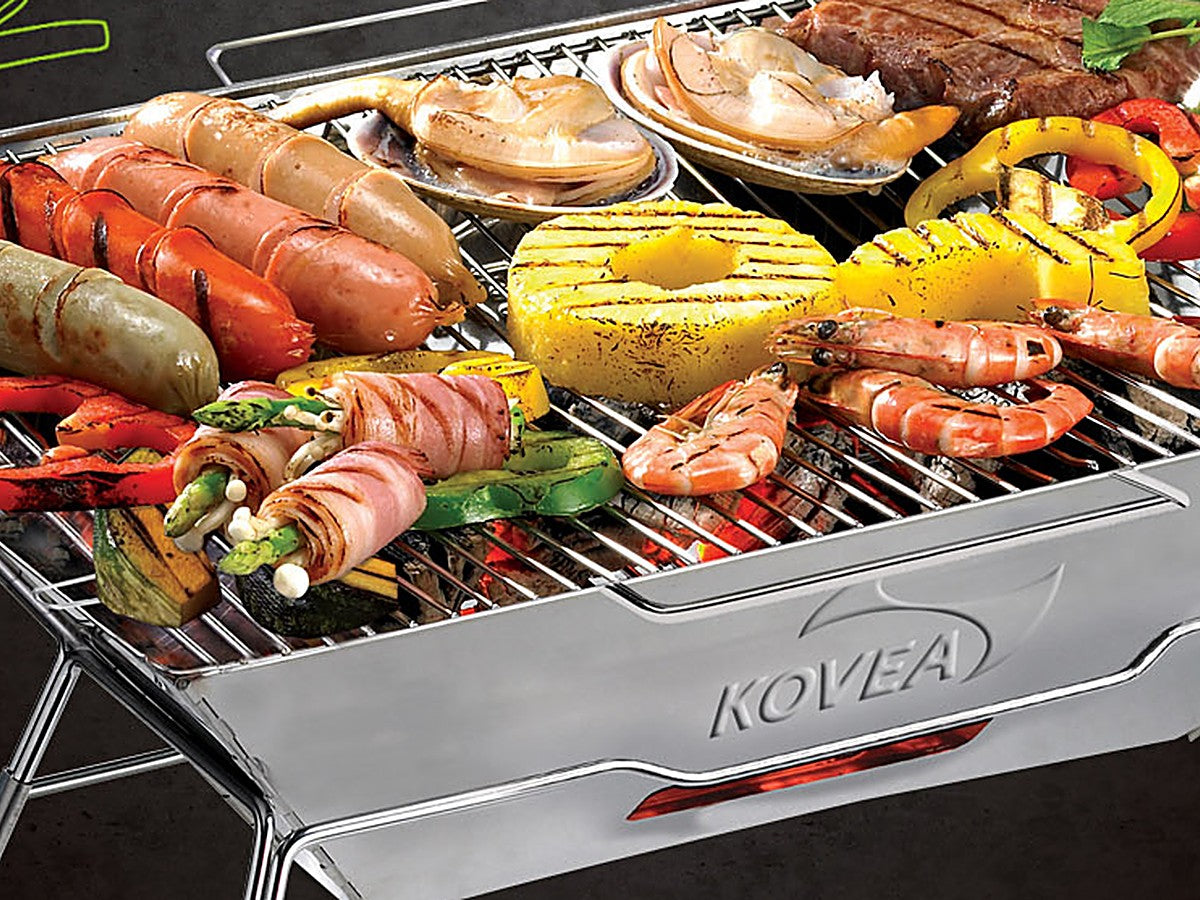 Assorted food grilling on the Magic 2 charcoal grill