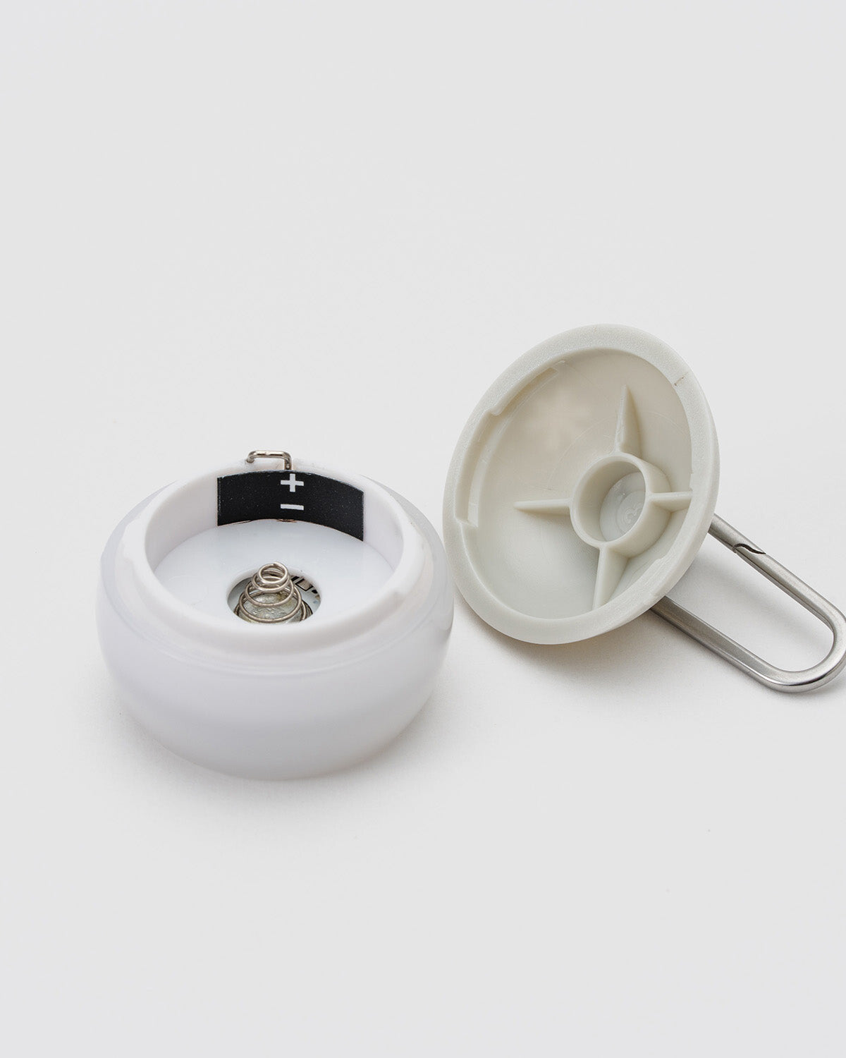 Micro Hozuki, Ivory, battery compartment opened showing the CR1632 coin cell