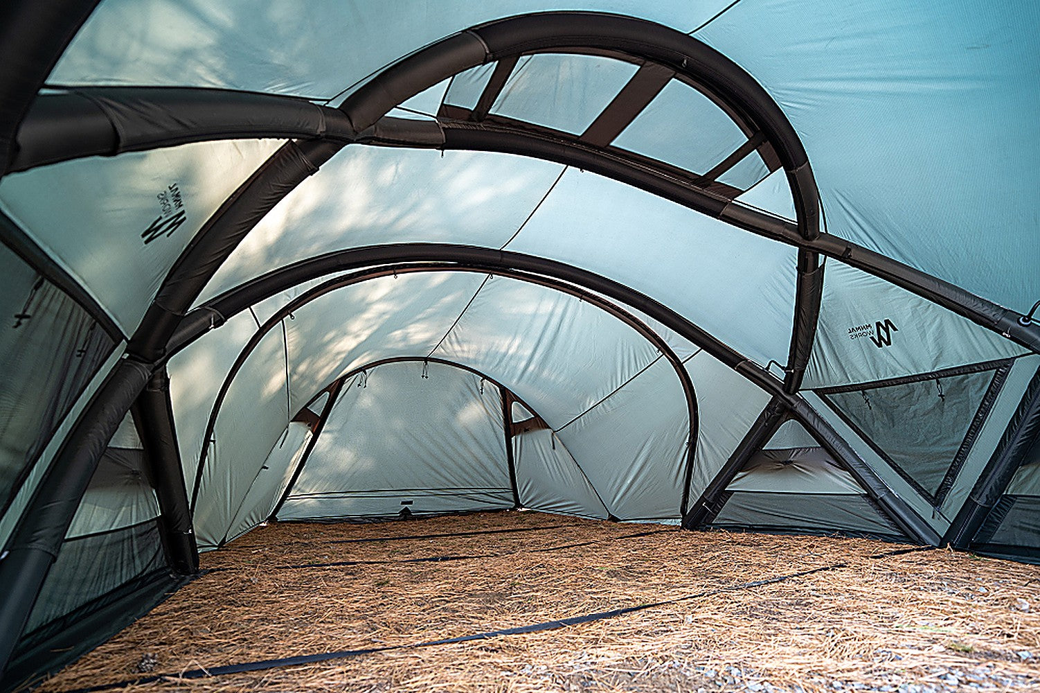 Interior view of the vestibule arch pole-and-sleeve frame creating headroom