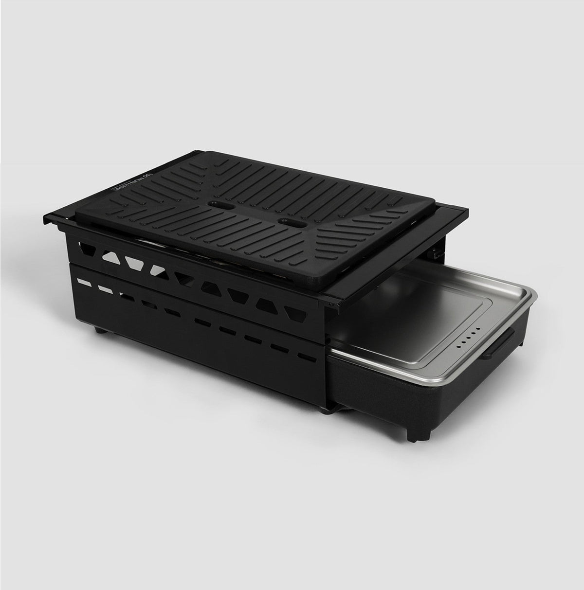 Monterra Add-on Multi Burner with the grill pan on top and the covered hot pot pan slid out