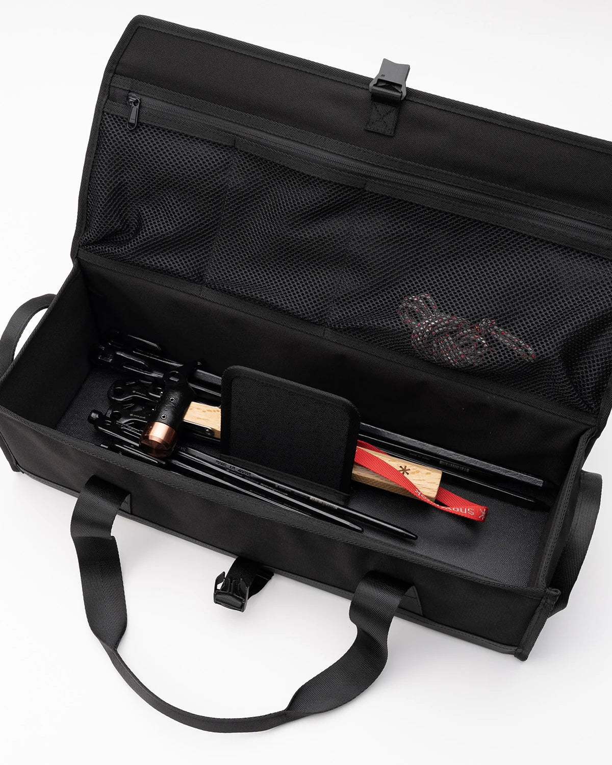 Multi Container, Large, open with poles, a mallet and long tools packed inside