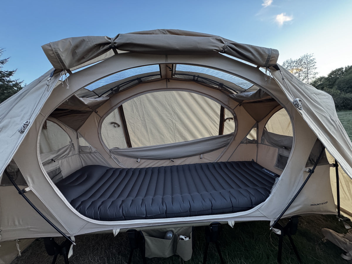 Natural rainfly fitted over the Neo Nest 80, front door open to the pad inside (tent, cot and pad sold separately).