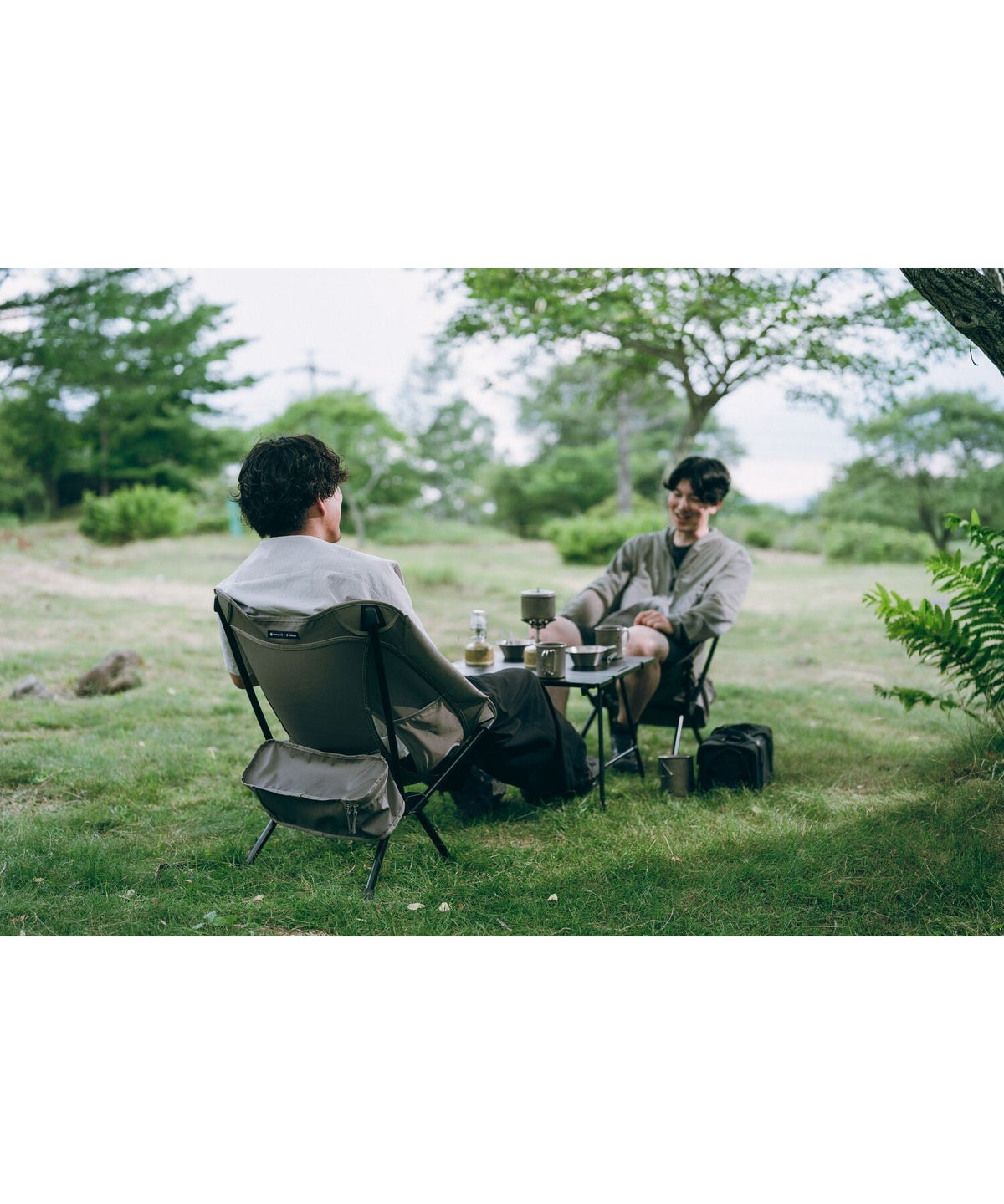 Noga Table, Black, in use at a lakeside campsite