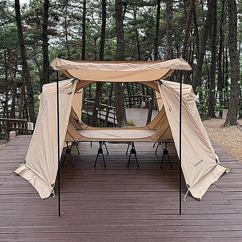 Tan rainfly seen head-on with the door panel held flat by two door poles (tent, rainfly and cot sold separately).