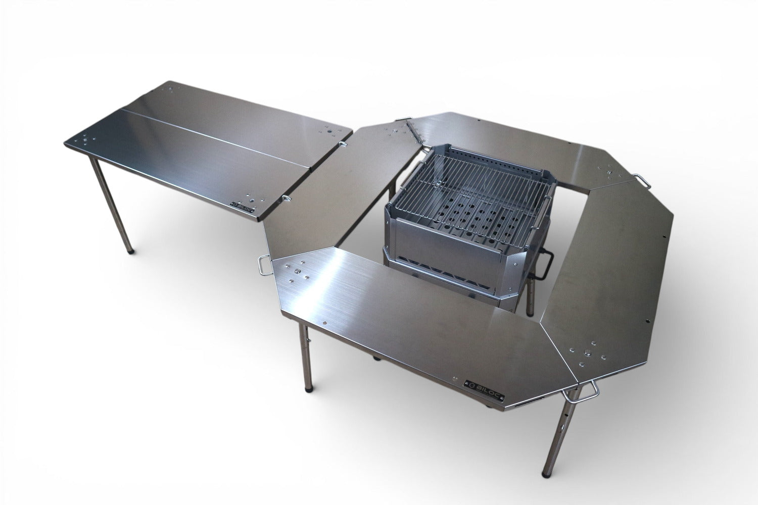 Silver Ribera used as a side wing to a silver Octa fire ring table in a full camp setup.
