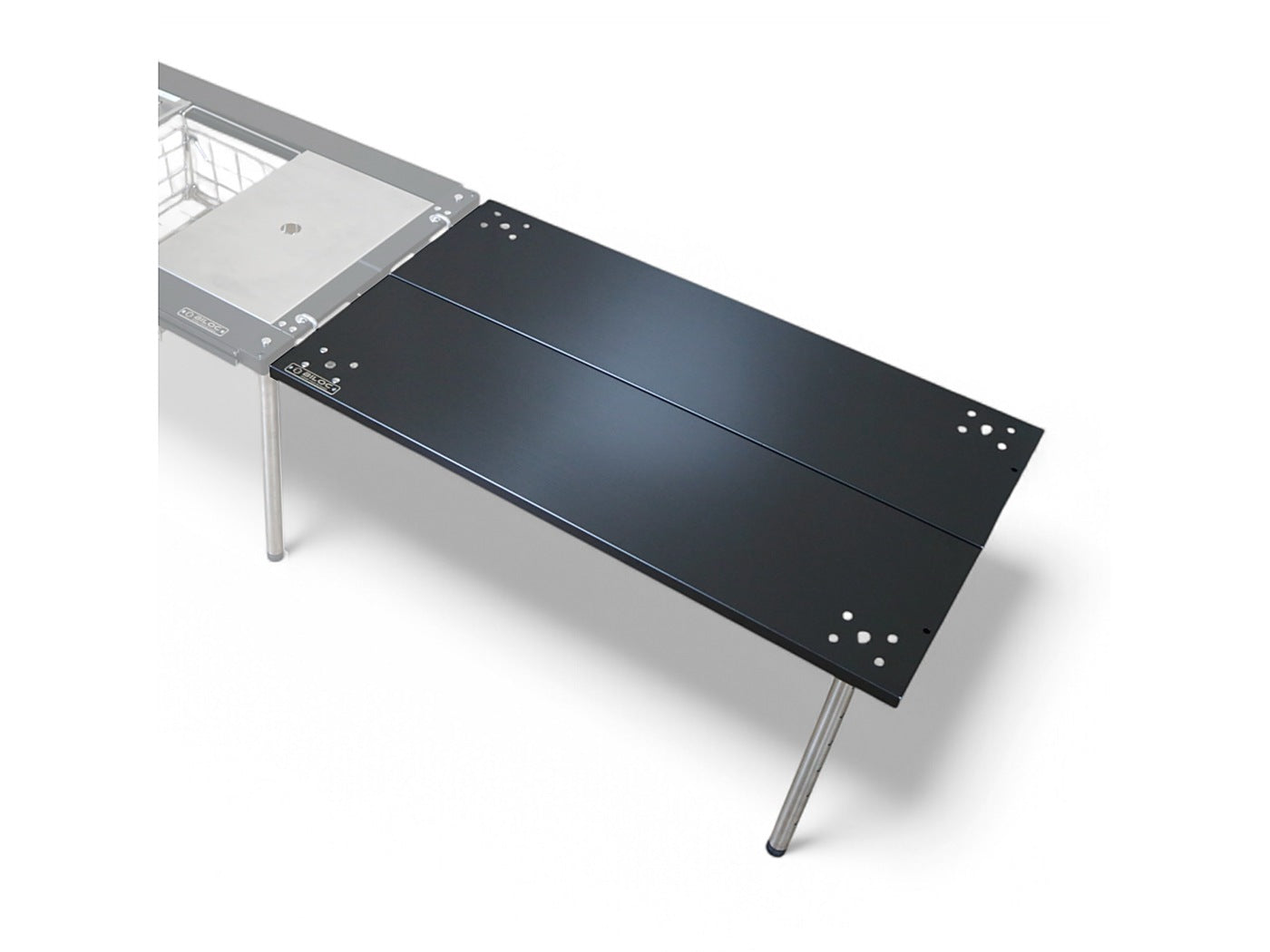 Black Ribera table joined to an IGT table as a wing, carried on the two included adjustable legs. The host table and gear shown are separate purchases.