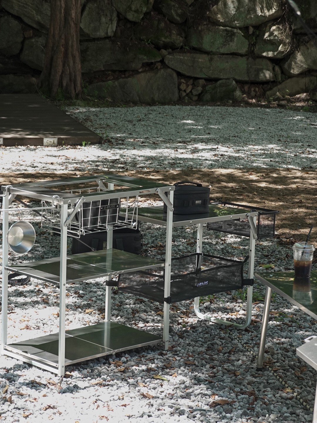 Two Biloc Stella shelves joined into an outdoor kitchen island at a campsite