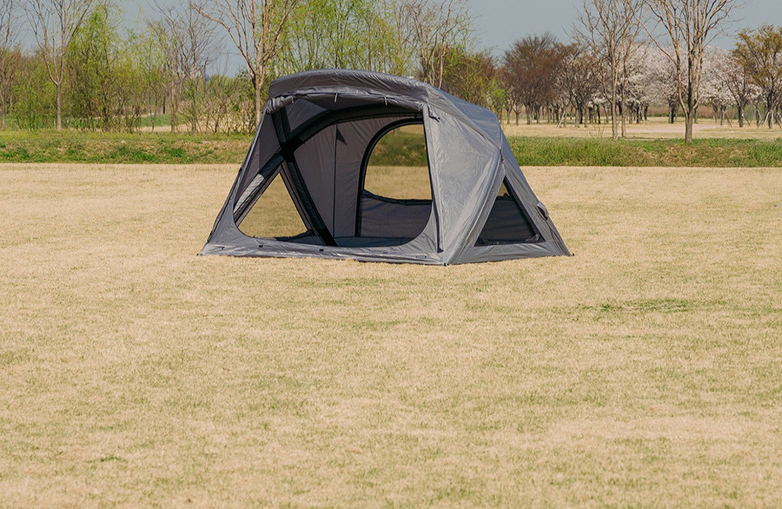Rooftop layer fitted over Geo-Air 4 inflatable cabin tent at campsite